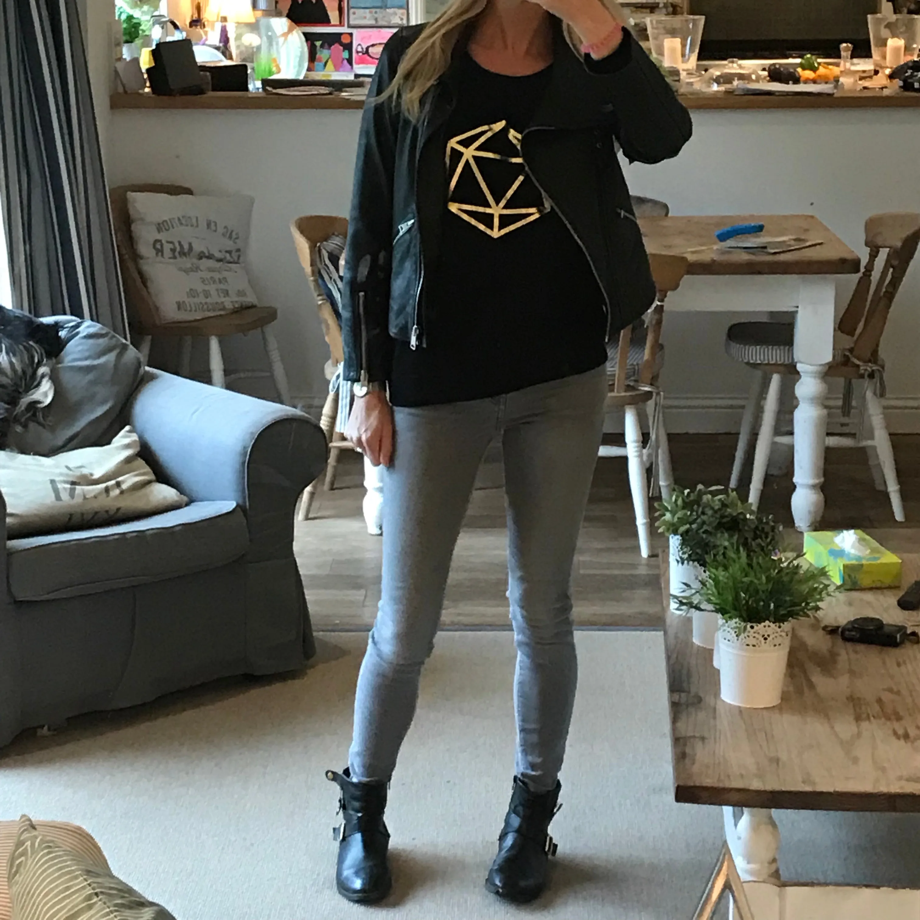 Metallic gold octahedron on black sweat