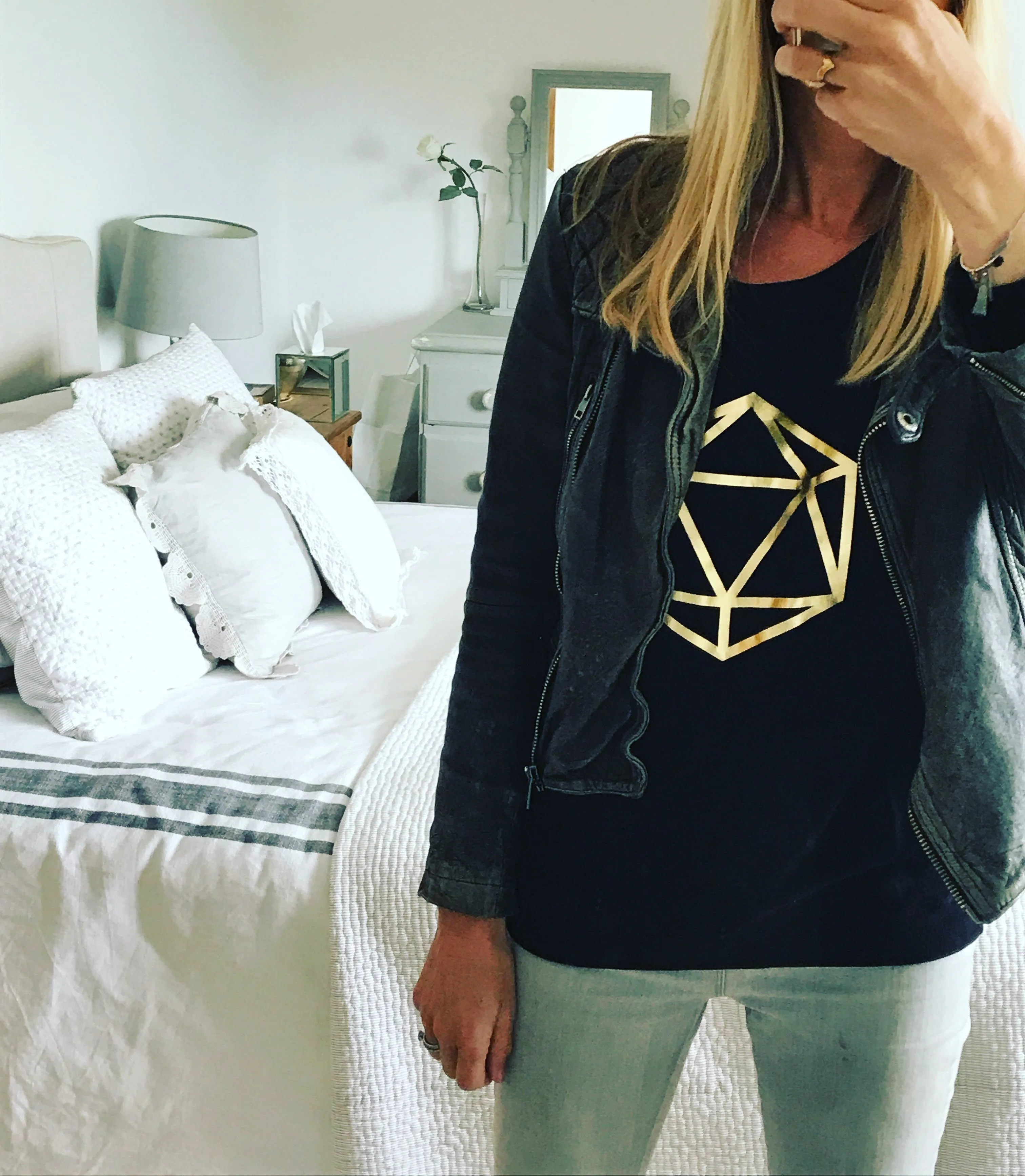 Metallic gold octahedron on black sweat